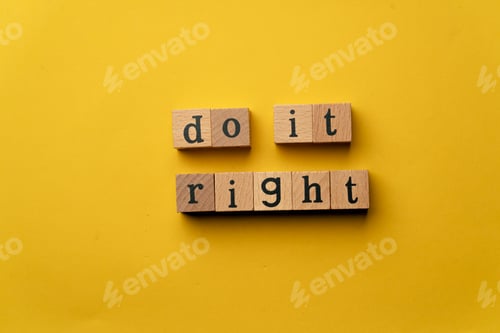Preview: a yellow warm background without shadows wooden cubes with black letters laid out word do it right
