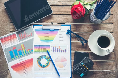 Preview: Office laptop business financial document chart and graph on wooden table with coffee cup