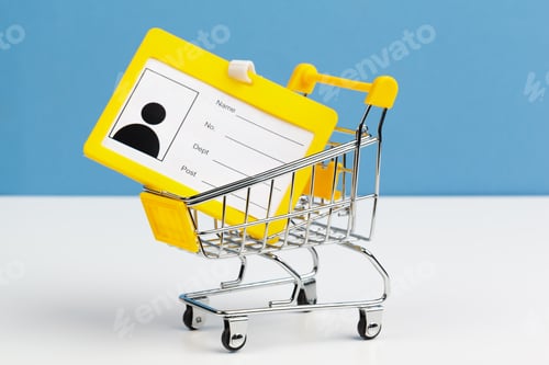 Preview: Selective focus of shopping cart or trolley with blank badge paper