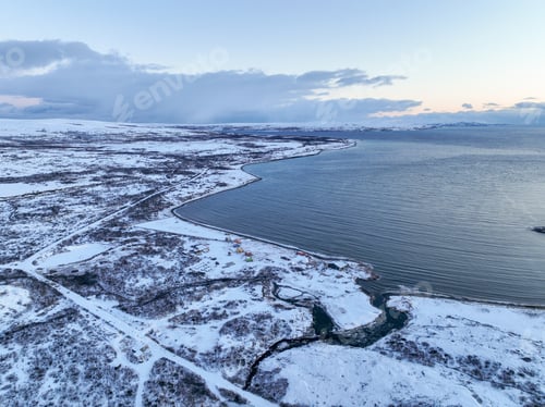 Preview: Small Arctic Village on Snowy Coastline Aerial Editorial