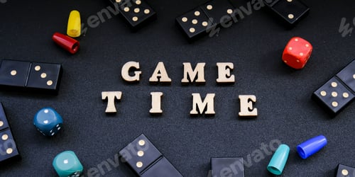 Preview: Text GAME TIME spelled out in wooden letter. Surrounded by dice, dominoes other game pieces on black
