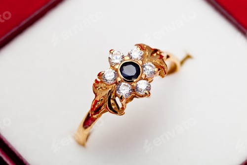 Preview: Gold ring with white and blue zirconia enchased