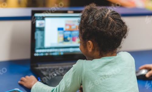 Preview: Diverse black girl sitting at a laptop computer