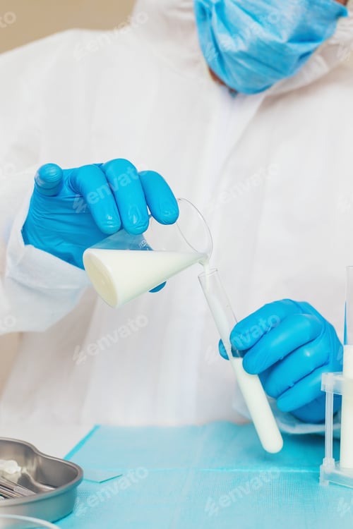Preview: Examine milk in the laboratory. Selective focus.