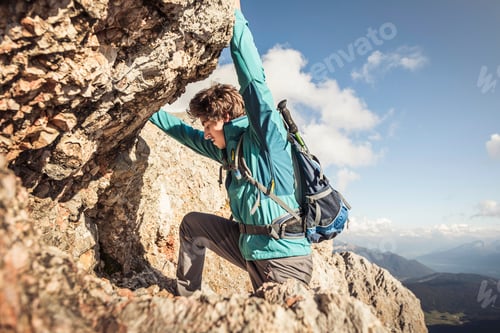 Preview: Adventurer scaling a rugged mountain terrain.