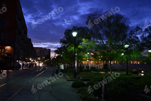 Preview: Historic River Walk district in Savannah, GA at night with the lights on
