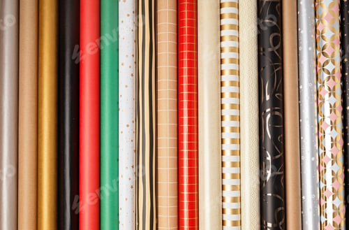 Preview: Christmas background with rolls of wrapping paper. Xmas celebration, preparation gifts