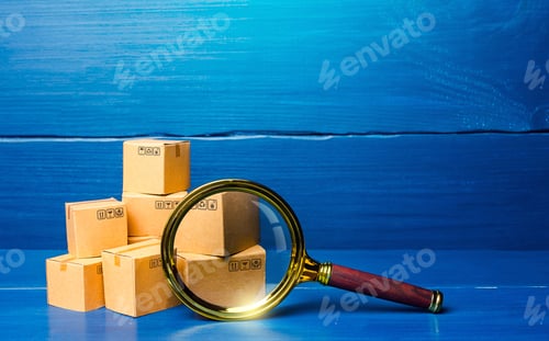 Preview: Cardboard boxes and magnifying glass. Concept of searching for goods and components
