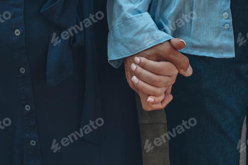 Preview: Couple, holding hands outdoor for love, relationship and date together with loyalty.