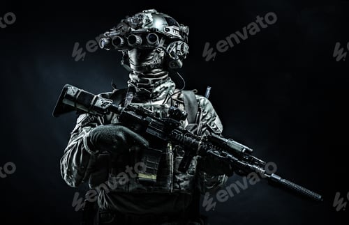 Preview: Modern combatant wearing night vision device black background