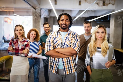 Preview: Happy business people celebrating success at company
