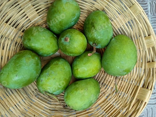 Preview: Green mango in basket in India, summer fruits