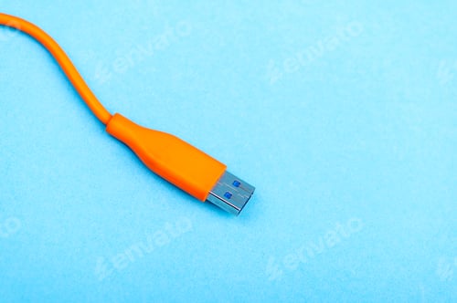 Preview: USB Cable Plug isolated on Blue Background