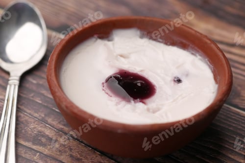 Preview: fresh blueberry yogurt in a bowl on table