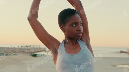 Preview: Young female athlete doing outdoor exercise, open air yoga