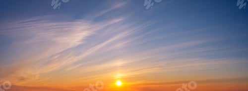 Preview: Dramatic sunset sky with vibrant colors and soft clouds over the horizon