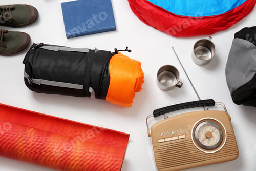 Preview: Flat lay composition with camping equipment on white background
