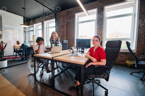 Preview: A diverse group of business professionals collaborates in a modern startup coworking center