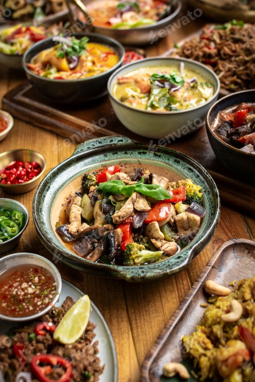 Preview: many different thai food dishes on table in modern restaurant in bangkok thailand