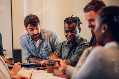 Preview: Multiracial business team working together and having a meeting in the office