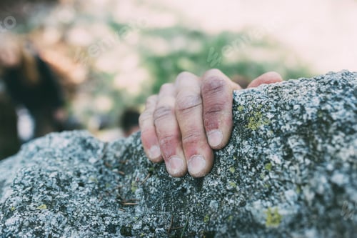 Preview: Hand of male boulderer gripping boulder edge, Lombardy, Italy