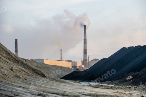 Preview: View of dirty road and big puddles or river between polluted hills and industrial factories