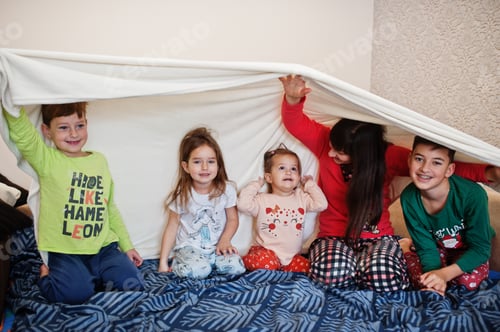 Preview: Happy big family is having fun together in bedroom