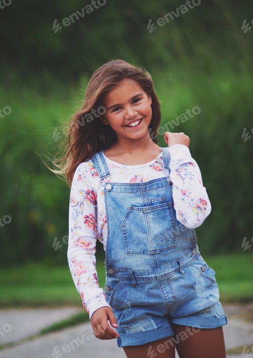 Preview: Young girl in trendy clothes walking candid portrait