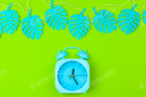 Preview: Tropical leaves with alarm clock