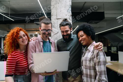 Preview: Diverse group of professionals meeting in office. IT programmers use computer, talk strategy