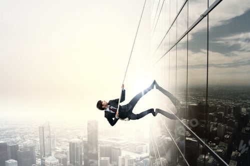 Preview: Determined Businessman Climbing Building With Help Of Rope