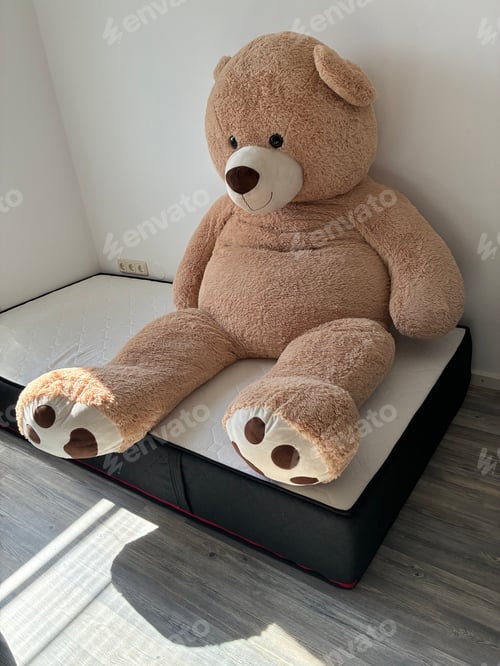 Preview: Giant Teddy Bear Sitting on Mattress