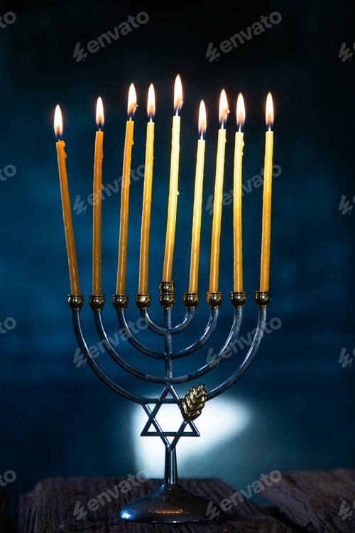 Preview: candles burning in menorah for Hannukah
