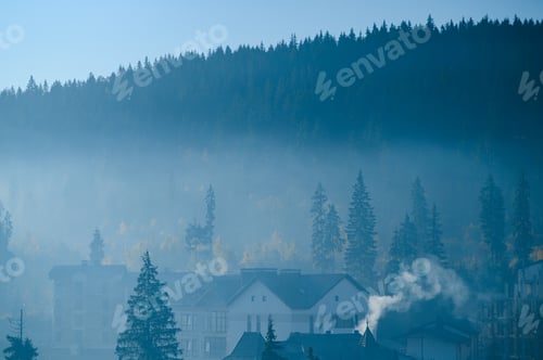 Preview: Alpine chains shrouded in the morning fog, seen from the top of Mittagskogel in Austria.