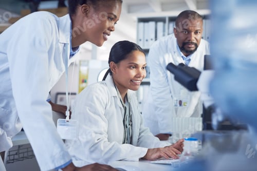 Preview: Shot of a group of scientists working together in a computer in a lab