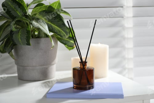 Preview: Spa composition with reed air freshener on white table indoors, closeup
