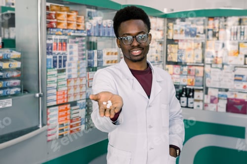 Preview: African-american doctor pharmacist man holding and offering white pills. Drug store and drug quality