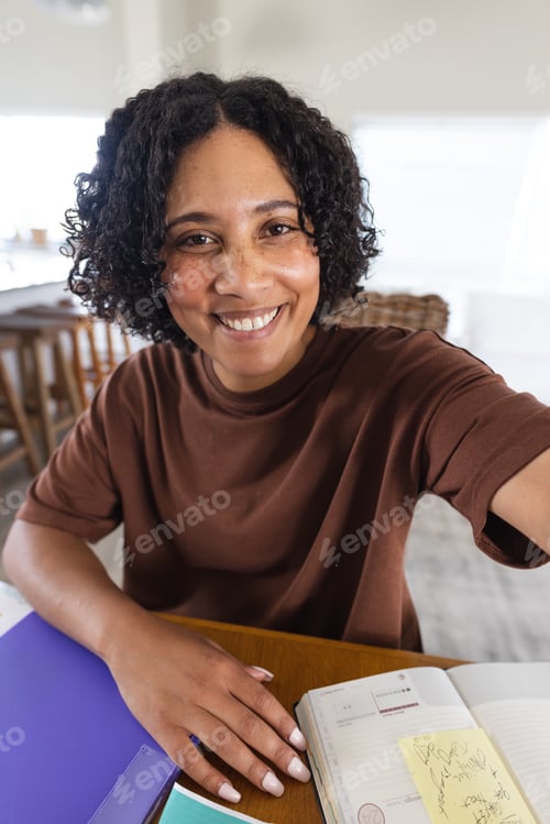 Preview: Happy biracial woman having video call