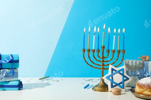Preview: Hanukkiah, gingerbread, gift boxes and donut on blue background, space for text