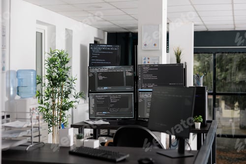 Preview: Pc desk with multiple monitors running terminal window