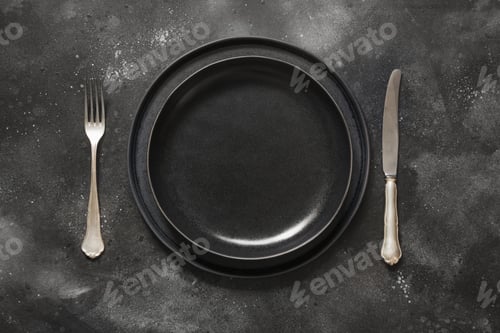 Preview: Dark place setting on black table. Top view.