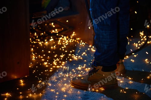Preview: Welding arcs and sparks falling down in repairman workshop