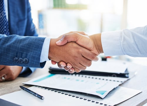 Preview: Shot of two unrecognizable businessmen shaking hands in a office