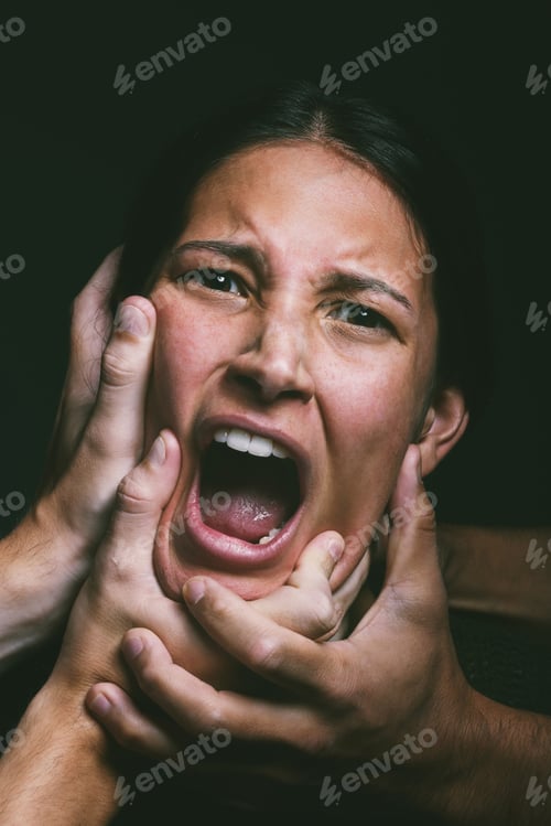 Preview: Somebody help me. Shot of hands grabbing a young womans neck against a dark background.