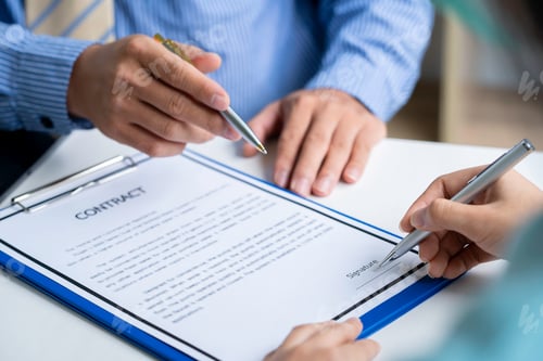 Preview: Businesswoman signing a document or application form in a folder, Businessmen hand's pointing where