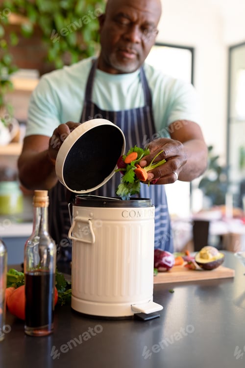 Preview: Serious african american senior man cooking in kitchen