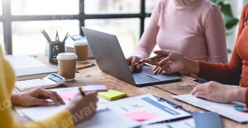 Preview: Business representatives meeting and planning graph presentation on laptop computer.