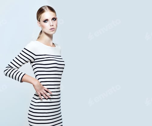 Preview: Super stylin. Studio shot of a stylish model with her hands on her hips.