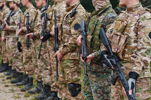 Preview: Soldier fighters standing together with guns. Group portrait of US army elite members, private