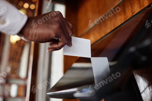 Preview: Close up of waiter tapping computer screen with ID card